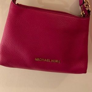 A pink cross body bag. Only worn once